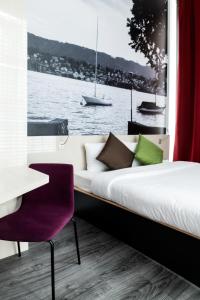 Postel nebo postele na pokoji v ubytování B&B HOTEL Zürich Wallisellen