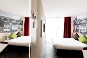 Postel nebo postele na pokoji v ubytování B&B HOTEL Zürich Wallisellen