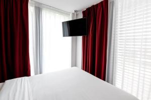 TV a/nebo společenská místnost v ubytování B&B HOTEL Zürich Wallisellen