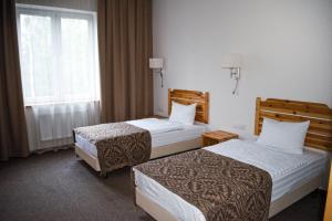 Кровать или кровати в номере Green Park Hotel Airport Minsk