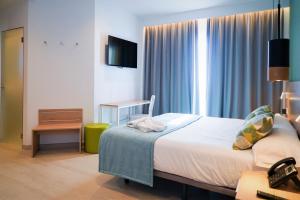 Postel nebo postele na pokoji v ubytování Hotel Seasun Aniram