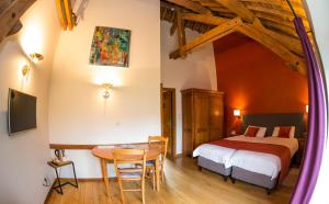 Un ou plusieurs lits dans un hébergement de l'établissement B&B Ferme Château de Laneffe