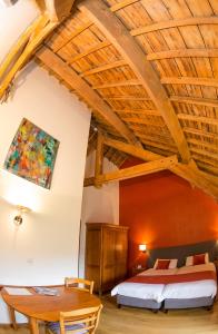 Un ou plusieurs lits dans un hébergement de l'établissement B&B Ferme Château de Laneffe