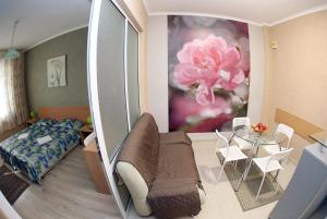 a living room with a couch and a table at COLORED HOUSE Apartments in Sofia