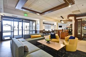 a lobby with couches and chairs and a table at Hyatt Place Kansas City/Overland Park/Metcalf in Overland Park