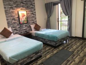 Ein Bett oder Betten in einem Zimmer der Unterkunft Khao Luang Resort