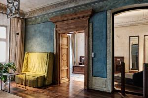 a bedroom with a bed in the corner of a room at Hotel Stary in Kraków