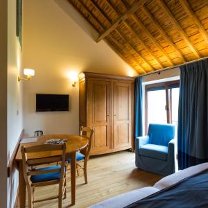 Télévision ou salle de divertissement dans l'établissement B&B Ferme Château de Laneffe