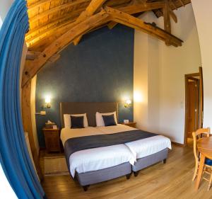 Un ou plusieurs lits dans un hébergement de l'établissement B&B Ferme Château de Laneffe