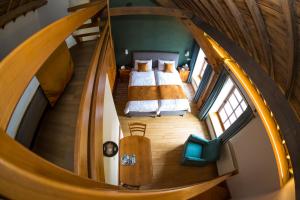 Un ou plusieurs lits dans un hébergement de l'établissement B&B Ferme Château de Laneffe