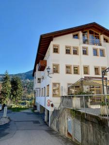 a large white building with a balcony on the side at Ferienwohnung Füsin in Berchtesgaden