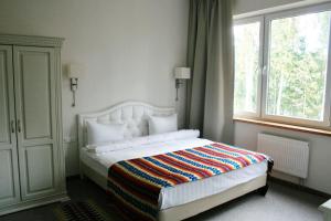 Кровать или кровати в номере Green Park Hotel Airport Minsk
