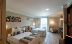 Łóżko lub łóżka w pokoju w obiekcie Flat Beira Mar em Recife