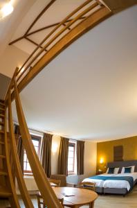 Un ou plusieurs lits dans un hébergement de l'établissement B&B Ferme Château de Laneffe