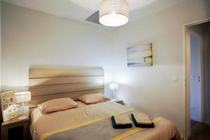 Ένα ή περισσότερα κρεβάτια σε δωμάτιο στο LE 112