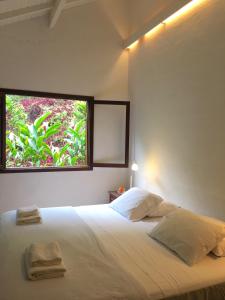 Cama ou camas em um quarto em O Sitio - Ilha Grande