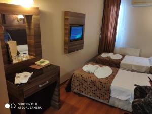 Postel nebo postele na pokoji v ubytování Hotel Bazaar