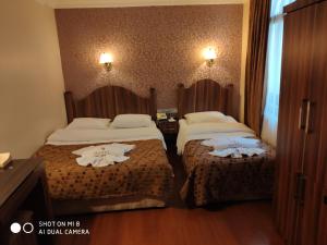 Postel nebo postele na pokoji v ubytování Hotel Bazaar