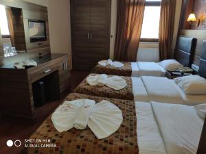 Postel nebo postele na pokoji v ubytování Hotel Bazaar
