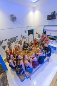 a group of people sitting around a table at Atlas Gili in Gili Trawangan