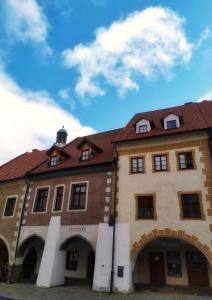 a large building with a red roof at Bed&Bike Prachatice in Prachatice