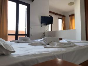 Posteľ alebo postele v izbe v ubytovaní Kyma Hotel