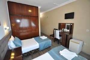 Postel nebo postele na pokoji v ubytování Reis Maris Hotel