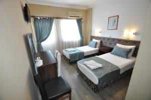 Postel nebo postele na pokoji v ubytování Reis Maris Hotel