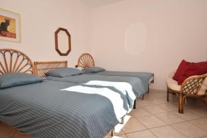 Postel nebo postele na pokoji v ubytování Appartamento Ciliegio