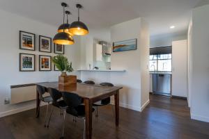 a kitchen and dining room with a table and chairs at Chester Street West Apartment in Christchurch