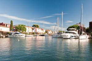 a group of boats are docked in a harbor at Maison de pêcheur in Grimaud
