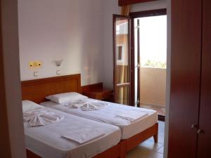 Posteľ alebo postele v izbe v ubytovaní Kyma Hotel