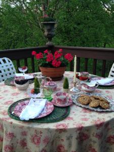 a table with plates of food and candles on it at Derinda House in Elizabeth +9 photos