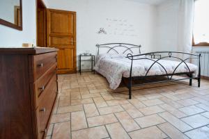 A bed or beds in a room at La Casa Dei Nonni