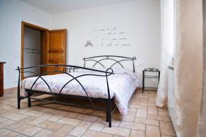 A bed or beds in a room at La Casa Dei Nonni