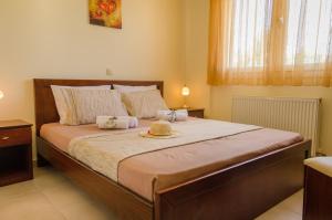 Postel nebo postele na pokoji v ubytování Olivera Apartments