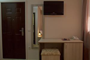 TV o dispositivi per l'intrattenimento presso Garni Hotel Tri O