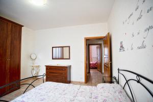A bed or beds in a room at La Casa Dei Nonni