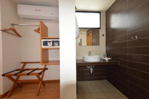 Koupelna v ubytování Centro 19 Hotel + 33 fotografií