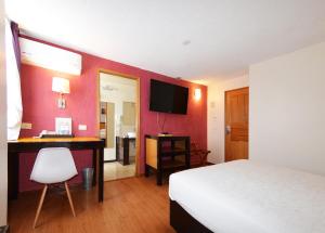 TV a/nebo společenská místnost v ubytování Centro 19 Hotel