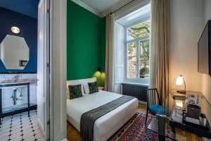 Postel nebo postele na pokoji v ubytování Communal Hotel Sololaki