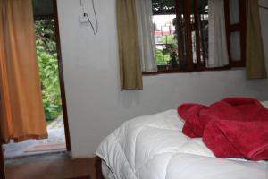 Una cama o camas en una habitación de Gurkha Lodge