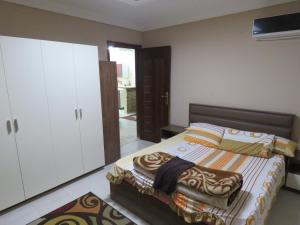 Ένα ή περισσότερα κρεβάτια σε δωμάτιο στο Gazzar inn Madinaty 25