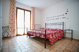 A bed or beds in a room at La Casa Dei Nonni