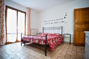 A bed or beds in a room at La Casa Dei Nonni