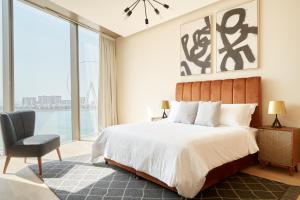 a hotel room with a large bed and a large window at Sonder at JBR The Walk in Dubai