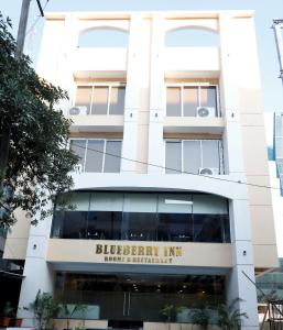 a building with the sign for the blueberry inn at Blueberry Inn in Raipur