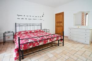 A bed or beds in a room at La Casa Dei Nonni