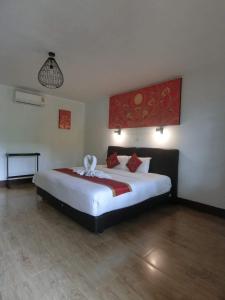 a bedroom with a white bed and white walls at The Krabi Forest Homestay in Ao Nang Beach