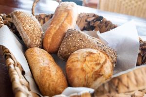 a basket filled with lots of different types of bread at Park Drentheland in Zorgvlied